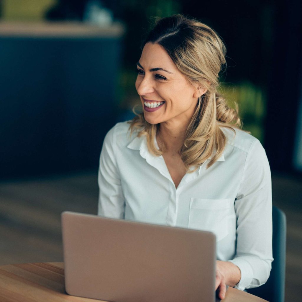 Woman Smiling Laptop